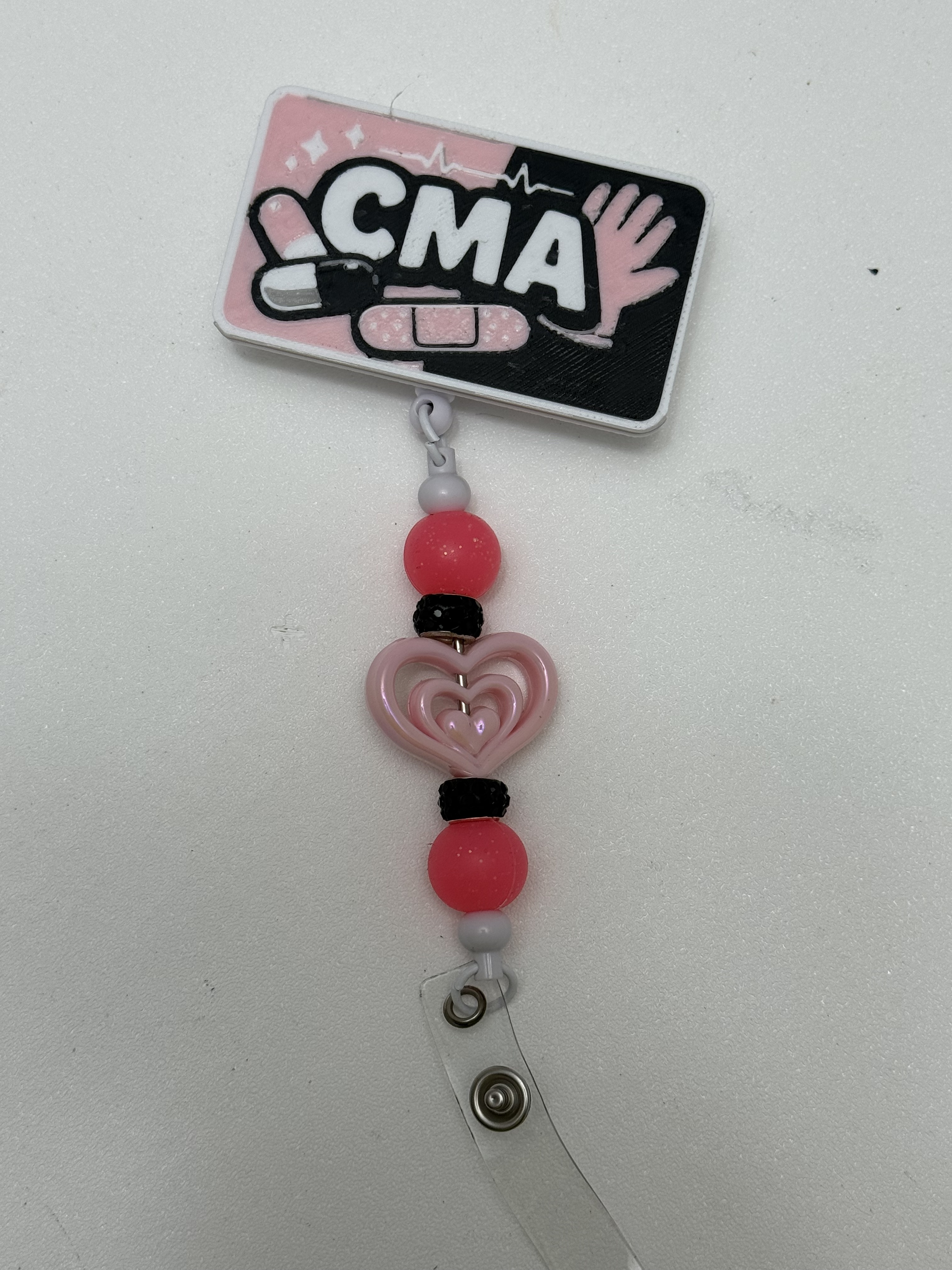 Retractable CMA badge reel with pink heart beads and black rhinestone spacers