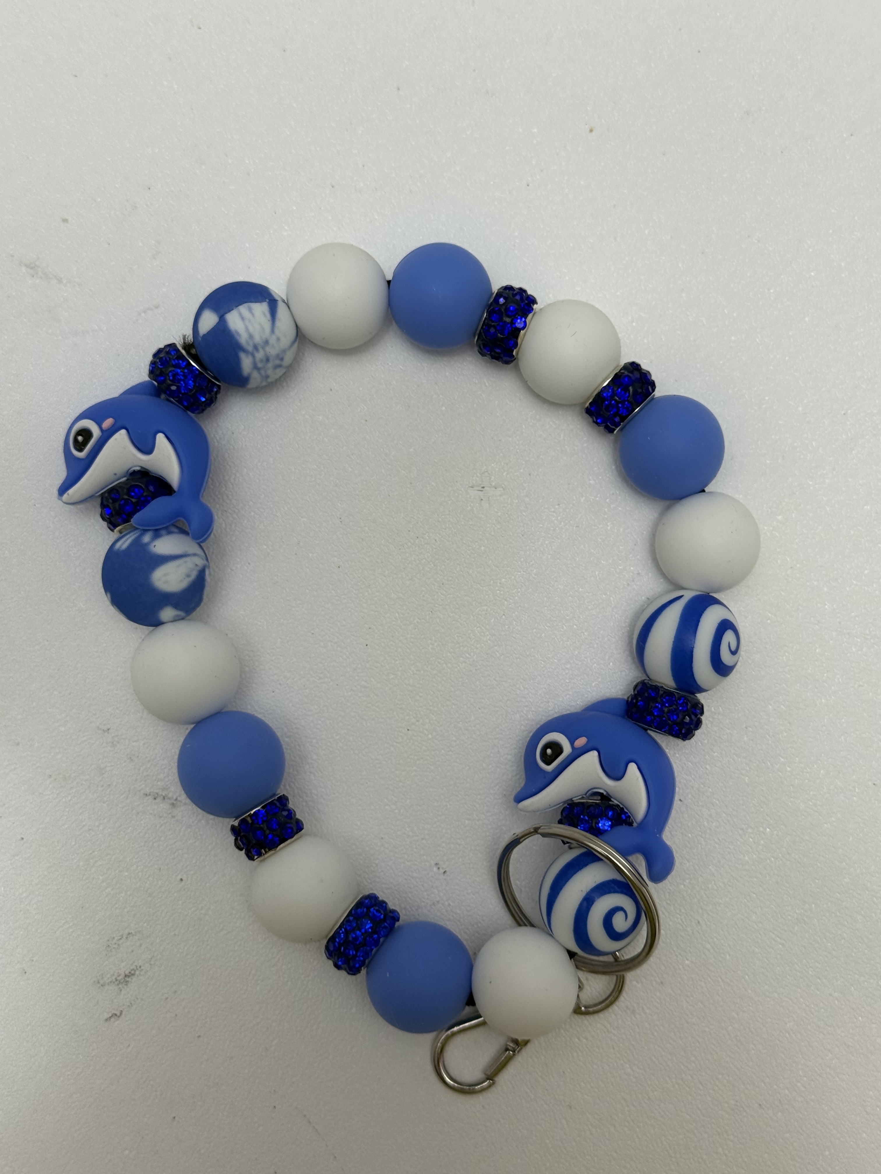 Blue and white beaded dolphin wristlet keychain with rhinestone rondelles and silver clasp