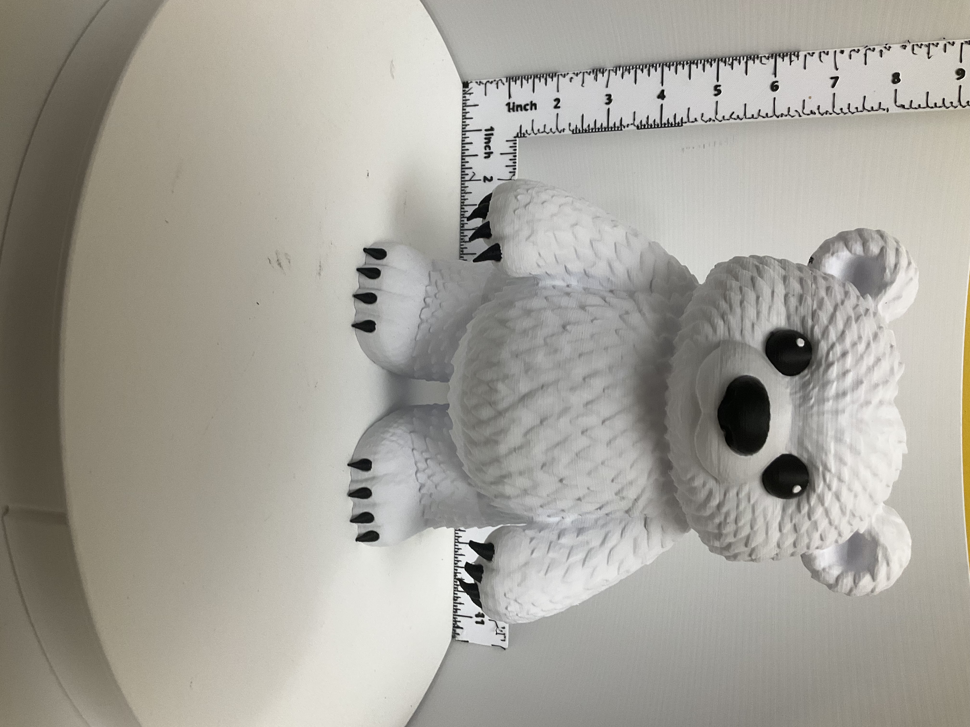 White 3D printed bear soap holder with textured fur and black claws standing upright