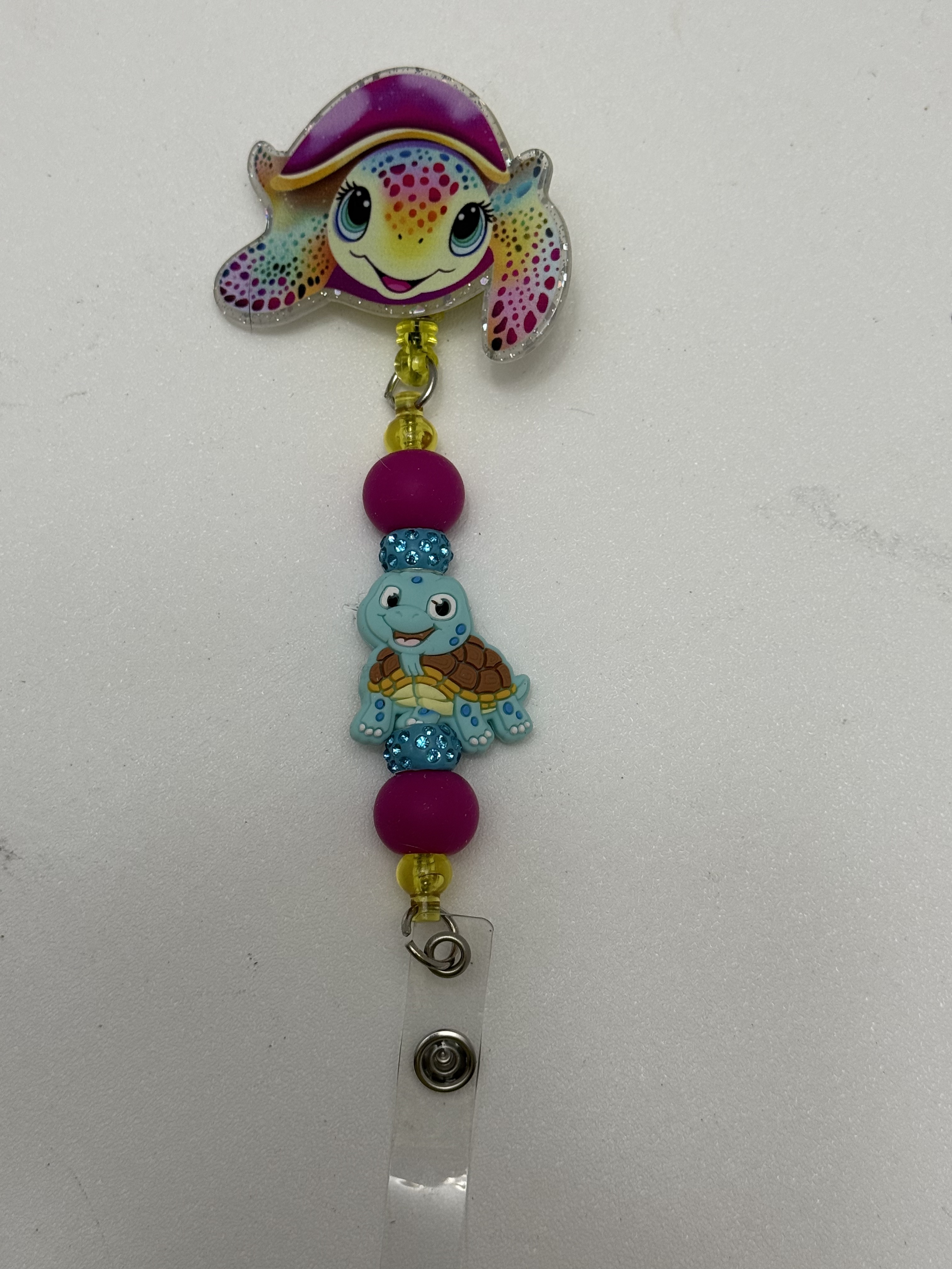 Retractable badge reel with rainbow sea turtle glitter topper and beaded turtle focal charm