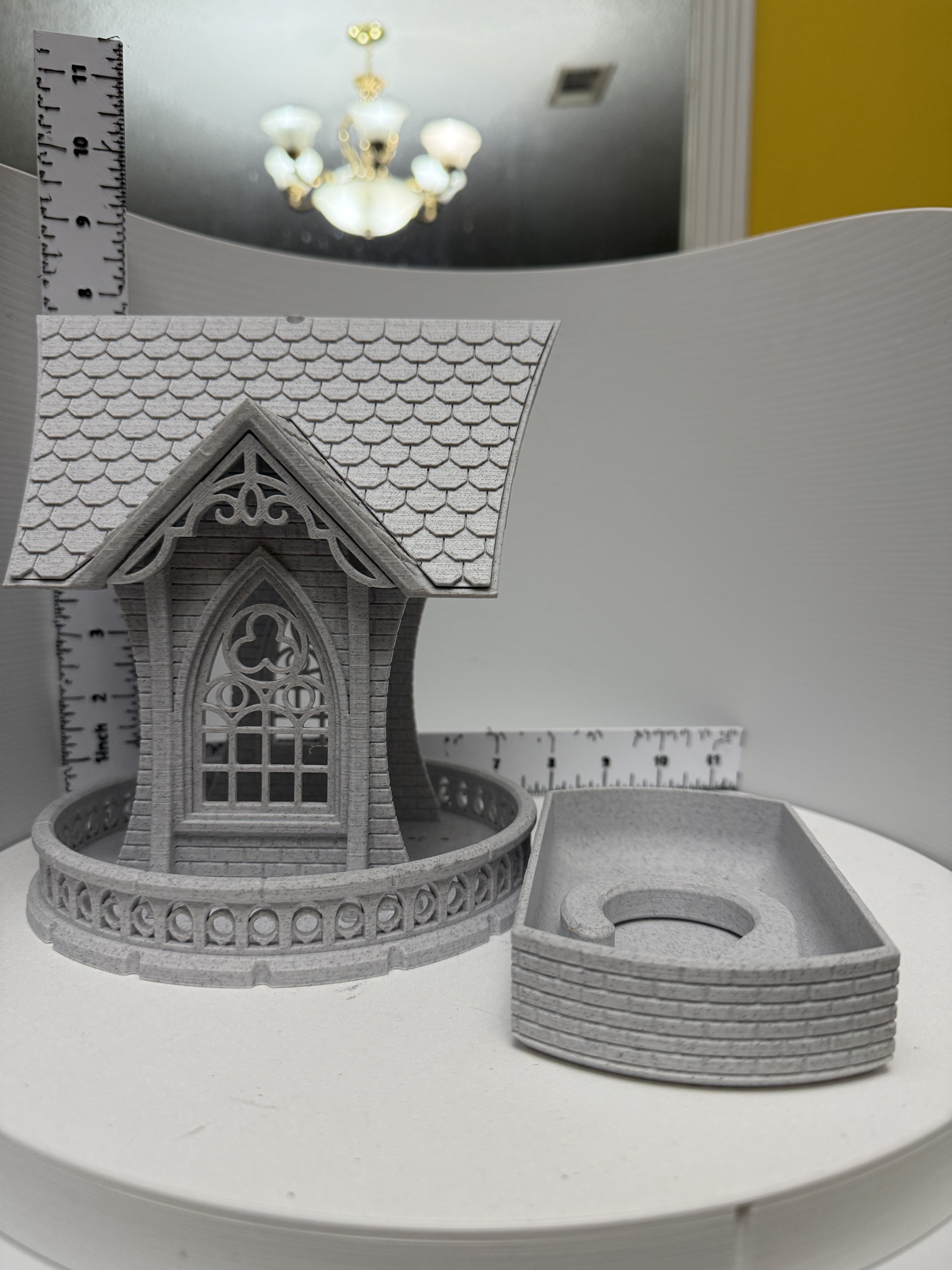 Gothic cottage ring holder with scalloped roof and arched tracery window shown disassembled beside its ring tray