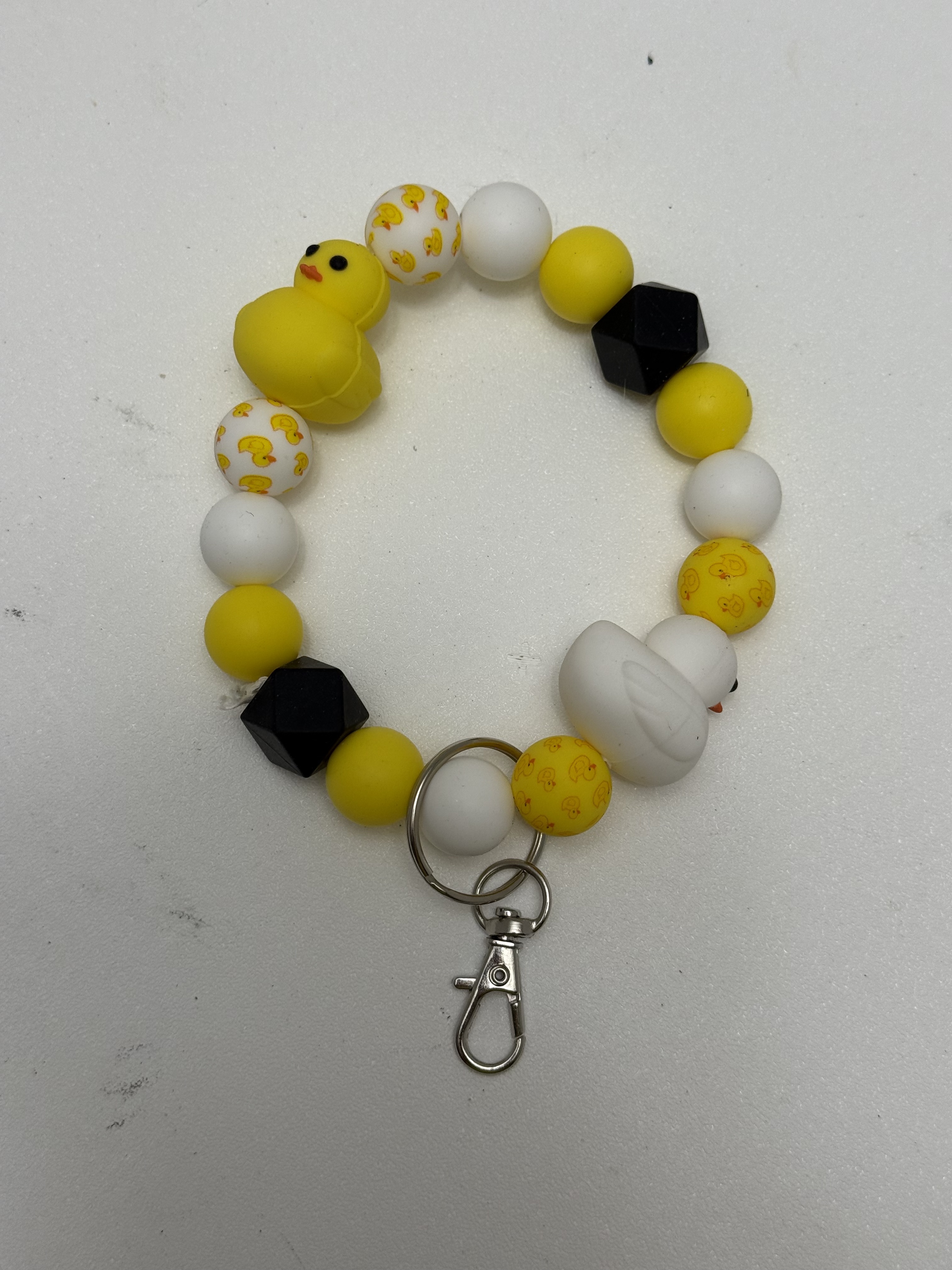 Yellow white and black beaded wristlet keychain with kawaii duck focal beads and silver lobster clasp